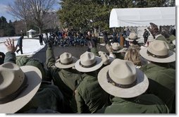 Rangers from the National Park Service wave to President George W. Bush and Laura Bush as they depart for Shenandoah National Park where the President discusses his National Park Centennial Initiative. The Initiative provides for the potential of up to a $3 billion infusion of new funds over the next ten years on top of appropriations for normal operations. "The funding starts with a billion-dollar request over the next 10 years that I'll send up to Congress," said President Bush of the largest ever increase for park operations. White House photo by Eric Draper