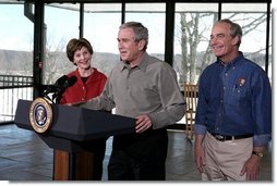 President George W. Bush addresses the press during a visit to Shenandoah National Park in Luray, Va., with Mrs. Laura Bush and Interior Secretary Dirk Kempthorne Wednesday, Feb. 7, 2007. "It is one thing to talk; it's another thing to act," said President Bush. "And I've just submitted a budget to the United States Congress. In it we've got a billion dollars new money for operating expenses." White House photo by Paul Morse