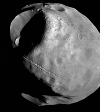 The six-mile wide Stickney crater dominates this image of Phobos taken by the Viking 1 orbiter.