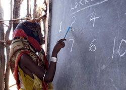A young Ethipian girl learns math at a Non-Formal Education Center.
