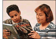 Teenagers reading a book together