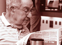 Image of man reading newspaper