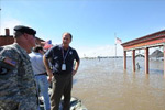 Regional Administrator Dick Hainje, right, talks with the US Army Corps of Engineers Lieutenant General Robert Van Antwerp, US Army Chief of Engineers at a point where a major sandbagging operation has taken place in order to protect the town from flooding. Jocelyn Augustino/FEMA