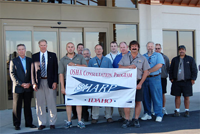 Left to right: OSHA’s Regional Administrator Richard Terrill, and Western Aircraft’s CEO, Allen Hoyt, along with employees of Western Aircraft’s Boise, Idaho location.