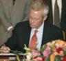 C. David Welch, Assistant Secretary for Near Eastern Affairs signs agreement in Tripoli, Libya. AP photo, Aug. 14, 2008.