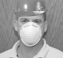 Photo of a worker wearing a diposable filtering facepiece respirator