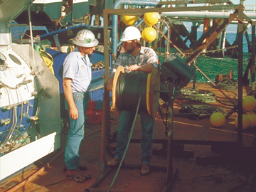 Scientists prepare a seismic probe for installation off the California coast