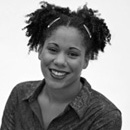 Photo of young woman with hair tied back on her head