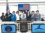 Secretary of Labor Elaine L. Chao rings the closing bell of the New York Stock Exchange. Pictured are (L to R): Director of Diversity at American Express, Lybra Clemons; American Express Executive Vice President of Consumer Cards, Larry Sharnack; Wi$e Up curriculum writer, Nancy Granovsky; Vice President of Global Diversity at American Express, Donna Wilson; Secretary of Labor, Elaine L. Chao; Executive VP, Global Corporate Client Group, NYSE Euronext, Noreen Culhane; Generation X employee of the Women's Bureau, Sarah Miller; Department of Labor Women’s Bureau Director, Shinae Chun; and Chair of the New York Chapter of the Financial Planning Association, Lauren Prince. (Photo credit/Ray Girard - Media Photo Group)