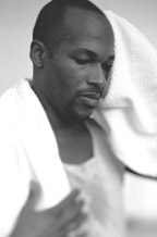 Photo of man toweling off after exercise.