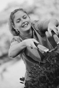 Photo of white woman gardening.