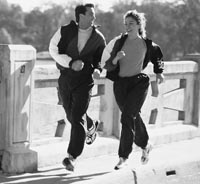 Photo of white male and white female jogging.