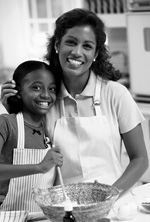 Picture of mother and daughter mixing ingredients in a bowl