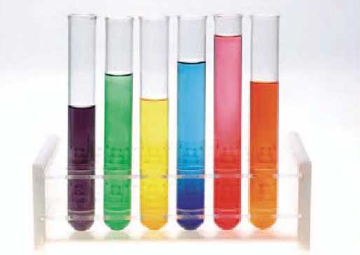 Photograph of a tray of test tubes containing different colored liquids