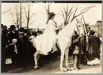 Inez Boissevain, wearing white cape, seated on white horse at the suffrage parade in Washington, D.C., 1913