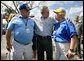 President George W. Bush greets Tennessee Southern Baptist Convention volunteers while visiting a food and distribution center, Thursday, Oct. 27, 2005, in the hurricane damaged area of Pompano Beach, Fla. White House photo by Eric Draper