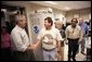 President George W. Bush visits the offices of the National Hurricane Center, Thursday, Oct. 27, 2005, in Miami, Fla. White House photo by Eric Draper