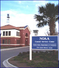 [Photo of NOAA Coastal Services Center sign and main entrance]