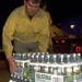 Worker stacking bottled water.