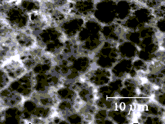 This is an image of the smooth shiny side of clean 5-micron filter