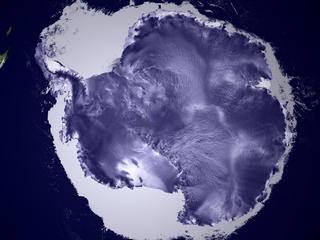 A birds eye view of the Antarctic continent surrounded by sea ice.