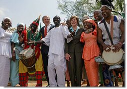 President George W. Bush and Mrs. Laura Bush stands with the Kankouran West African Dance Company after delivering remarks during a ceremony marking Malaria Awareness Day Wednesday, April 25, 2007, in the Rose Garden. "The American people, through their government, are working to end this epidemic,"said President Bush. "In 2005, President Bush announced the President's Malaria Initiative -- a five-year, $1.2 billion program to combat malaria in the hardest-hit African nations."  White House photo by Eric Draper