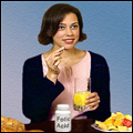 Photo: A woman taking a Folic Acid tablet