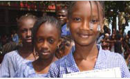 Guinean schoolgirls receive language arts textbooks donated by USAID - Click to read this story