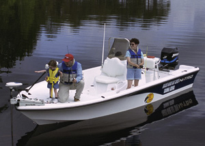 Family fishing from powerboat on lake. Credit: USFWS