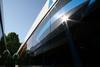 The morning sun is seen reflecting in the window of a brand new 2007 Gillig at StarMetro's Maintenance facility