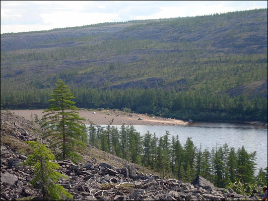 Photograph of Kotuykan River Expedition campsite and the steep mountainsides of the Siberian Traps.