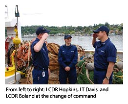 LCDR Hopkins and LCDR Boland salute at the change of command