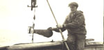 man with  current meter - alaska 1920's