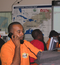 A member of a Community Emergency Response Team takes a call in the Scarborough response center in Tobago.