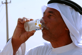 An Iraqi man drinks fresh water from an artesian well that was installed at the al-Hamza School in Bayjia, Iraq. The well was built using Commander’s Emergency Relief Program funds provided by the 2nd Brigade Combat Team, 3rd Infantry Division.