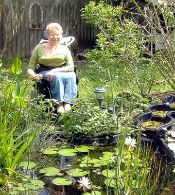 Peg Nosek in her spring watergarden, March 2007 