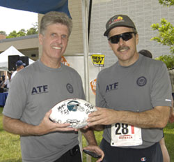Photo of runners with sports memorabilia.