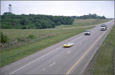 Photo of solar powered cars racing during the 2002 Sunrayce contest.