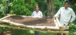 Subsistence farmers Margarita Flores and Rodrigo Flores use new techniques learned at a USAID workshop.