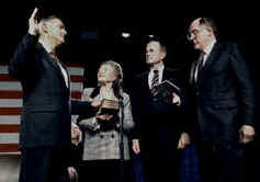 photo of Admiral James D. Watkins sworn in as Secretary of Energy. (L to R) Watkins, Mrs. Watkins, President Bush, and Chief Justice William H. Rehnquist