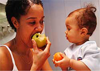 Mom and Child eating fruit.