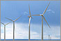 Photo of four wind turbines.