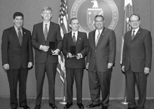 Secretary Abraham presents the Secretary's Gold Award to two leaders of the Federal Government Human Genome Project: Francis Collins and Aristides Patrinos.  Also shown are Elias Zerhouni, and Raymond Orbach.