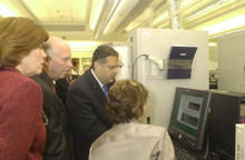 Secretary Abraham receives a briefing at The Institue for Genomics Research (TIGR).  At left are Claire Frasier, TIGR President and Riector, and J. Craig Venter, President, Institute for Biological Energy Alternatives.