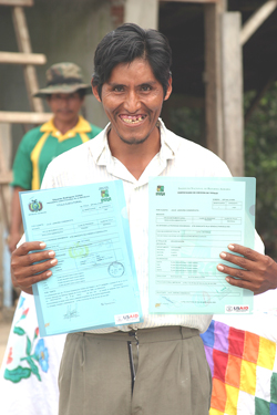 Julio Jankoña, a Bolivian farmer in the Chapare region of Bolivia, proudly shows his legal land titles.