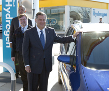 Secretary Abraham, Shell Hydrogen CEO Jerry Bentham, and District of Columbia Mayor Anthony Williams stand beside a General Motors hydrogen fuel cell vehicle at the Shell hydrogen refuling station in Washington, D.C.