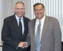 Secretary Abraham and Overseas Private Investment Corporation President and CEO Dr. Peter S. Watson.