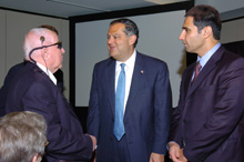 Secretary Abraham greets Harold Churchey, the first patient to receive a prototpe artificial retina implant.  Right is Dr. Mark Humayun, University of Southern California Doheny Eye Institute.