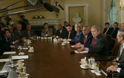 President George W. Bush answers reporters' questions