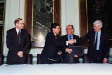 Neal Lane, Director, National Science Foundation; Secretary Pena; Luciano Maiani, President, CERN Council; and Christopher Llewellyn Smith, Director General, CERN, at the Large Hadron Collider signing ceremony at the White House Old Executive Office Building